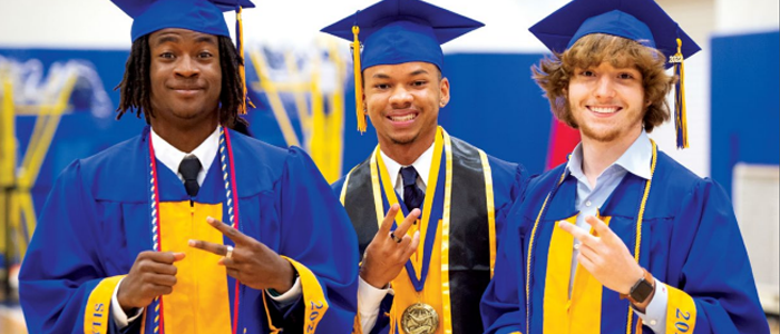 Graduating students smiling