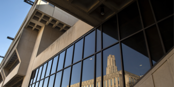 Posvar Hall, with Cathedral reflected off the glass of library