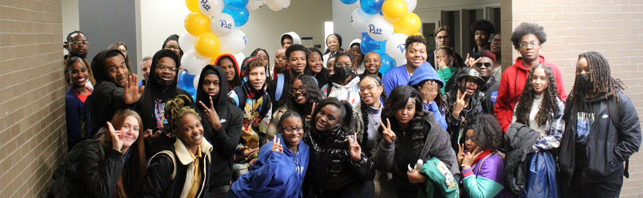 Group of students posing by ballons